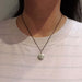 Mini vintage sterling silver locket necklace worn on model