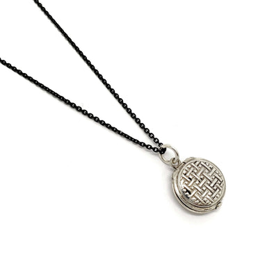 Mini vintage sterling silver locket with embroidered pattern on black chain