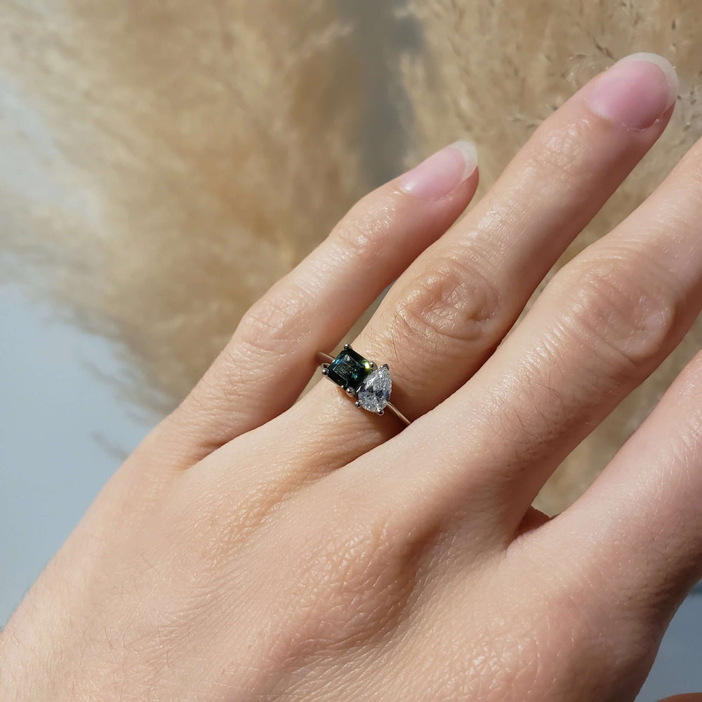 Moi et toi sapphire and lab diamond engagement ring in white gold shown on hand