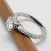 Detailed view of moissanite solitaire ring with wheat engraving on band