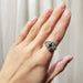 Montana sapphire and Canadian diamond white gold ring worn on hand, full view
