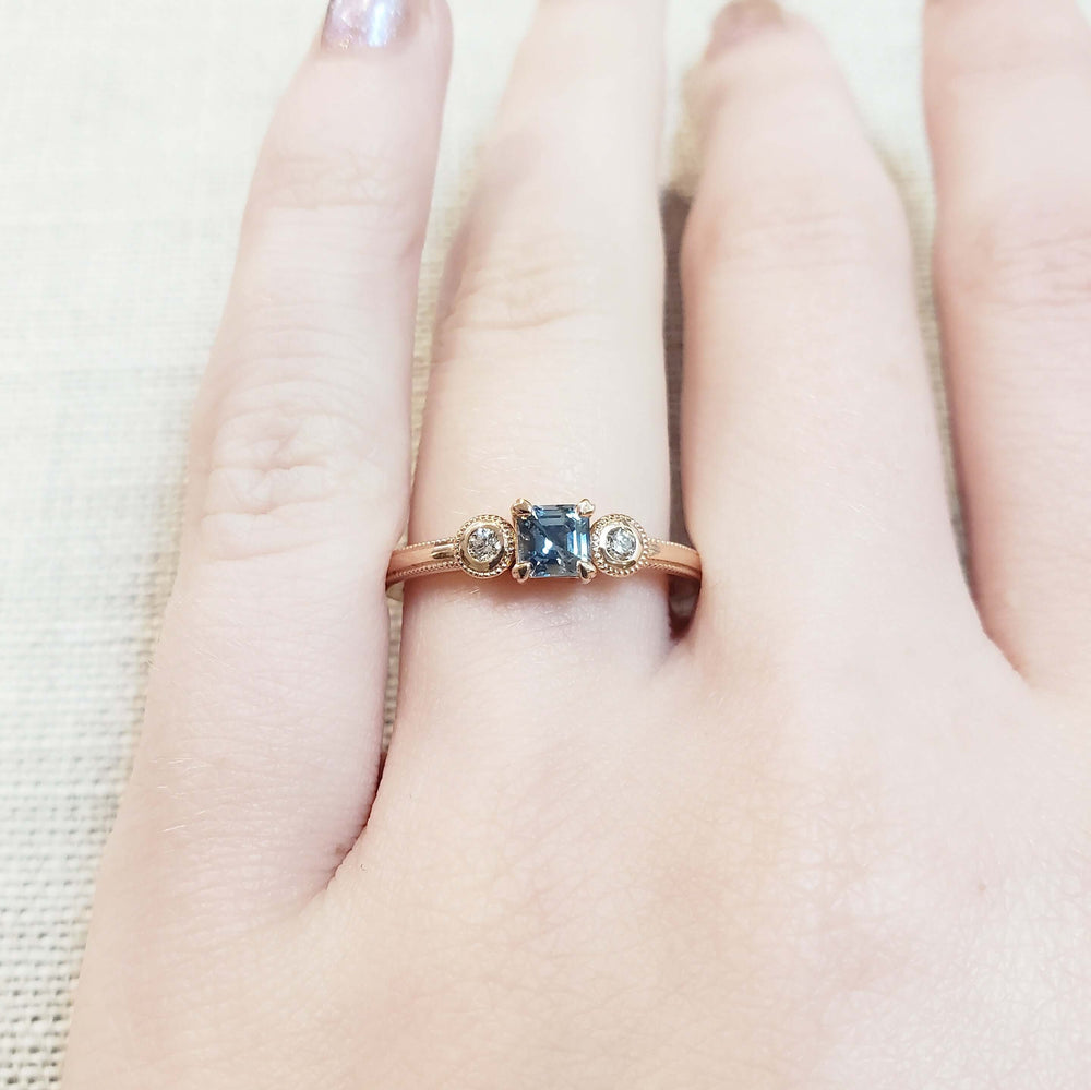 14kt rose gold Montana sapphire and diamond ring shown on hand