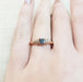 14kt rose gold Montana sapphire and diamond ring shown on hand