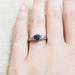 Montana sapphire and diamond three-stone ring in white gold, shown on hand