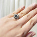 Montana sapphire and diamond white gold ring shown on a hand, close-up