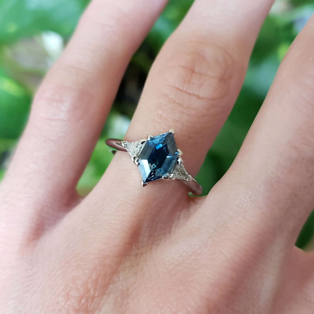 Montana sapphire and diamond white gold ring worn on hand