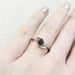 14kt white gold Montana sapphire leaf ring worn on a hand