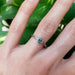 Montana sapphire white gold engagement ring on hand, intricate engraved details