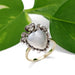 Georgian moonstone and diamond heart ring in yellow gold, displayed with green leaves