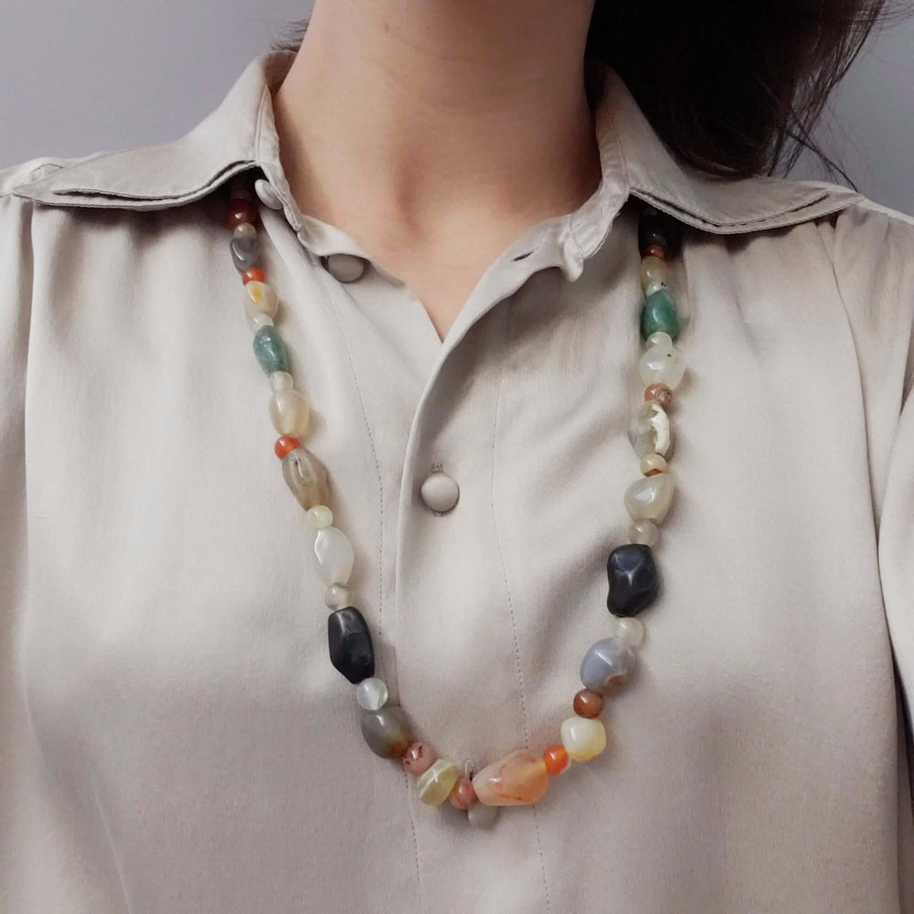 Multicolour agate bead necklace worn on a model, showing length and style