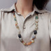 Multicolour agate bead necklace worn on a model, showing length and style