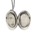 Open vintage Birks sterling silver locket with two photo compartments