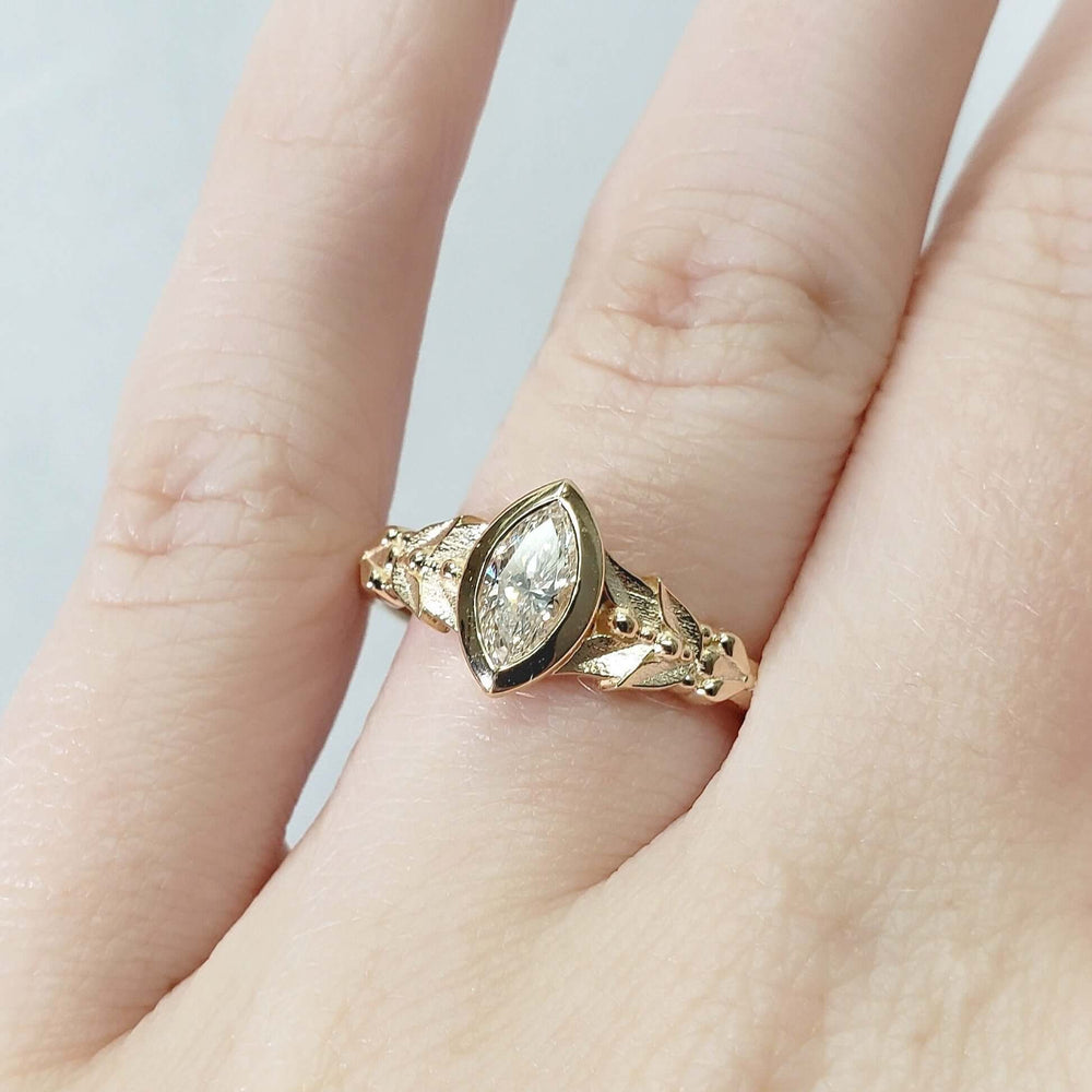 Oriana 14kt yellow gold marquise lab diamond ring shown on a hand