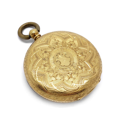 Engraved 18kt yellow gold case of antique pocket watch with ornate detailing