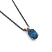 Oval London topaz pendant in 14kt rose gold on a black chain