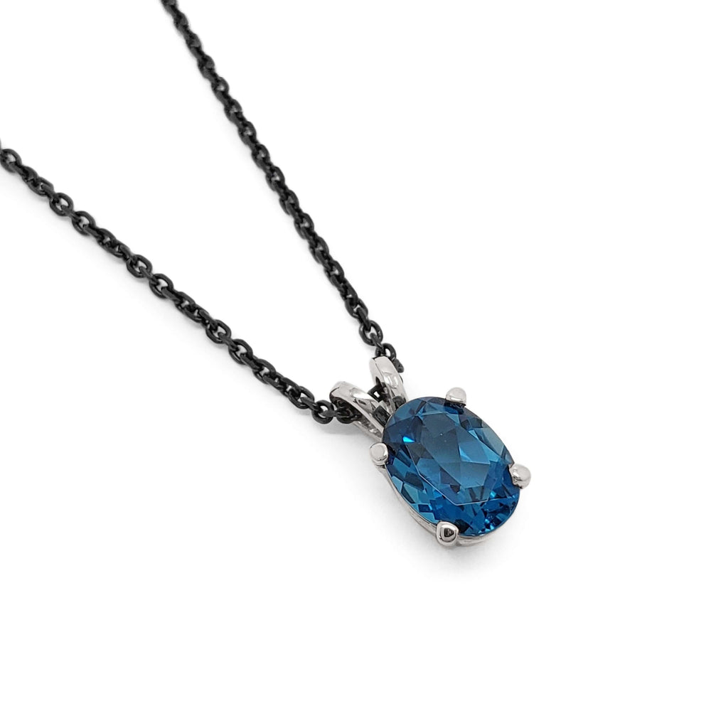 Oval London topaz pendant in 14kt white gold on a black chain