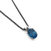 Oval London topaz pendant in 14kt white gold on a black chain
