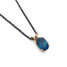 Oval London topaz pendant in 14kt yellow gold on a black chain