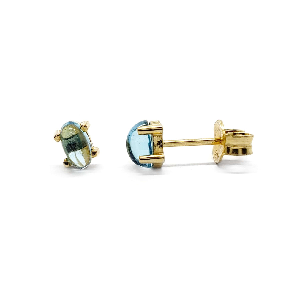 Pair of oval cabochon Swiss blue topaz stud earrings in 14kt yellow gold