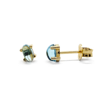 Pair of oval cabochon Swiss blue topaz stud earrings in 14kt yellow gold