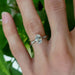 Oval lab diamond white gold engagement ring with pave band shown on hand
