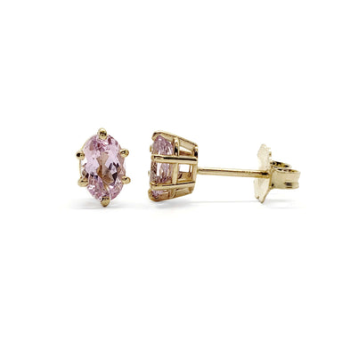 Pair of oval pink imperial topaz stud earrings in 14kt yellow gold, six-prong setting