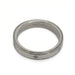Overhead view of 14k white gold wedding ring with diamond accents and millgrain edge