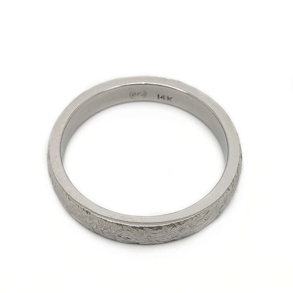 Overhead view of 14kt white gold elephant skin texture wedding ring