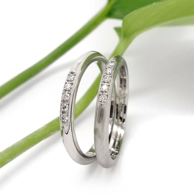 Pair of 14kt white gold wedding rings with Canadian diamonds, one polished, one matte