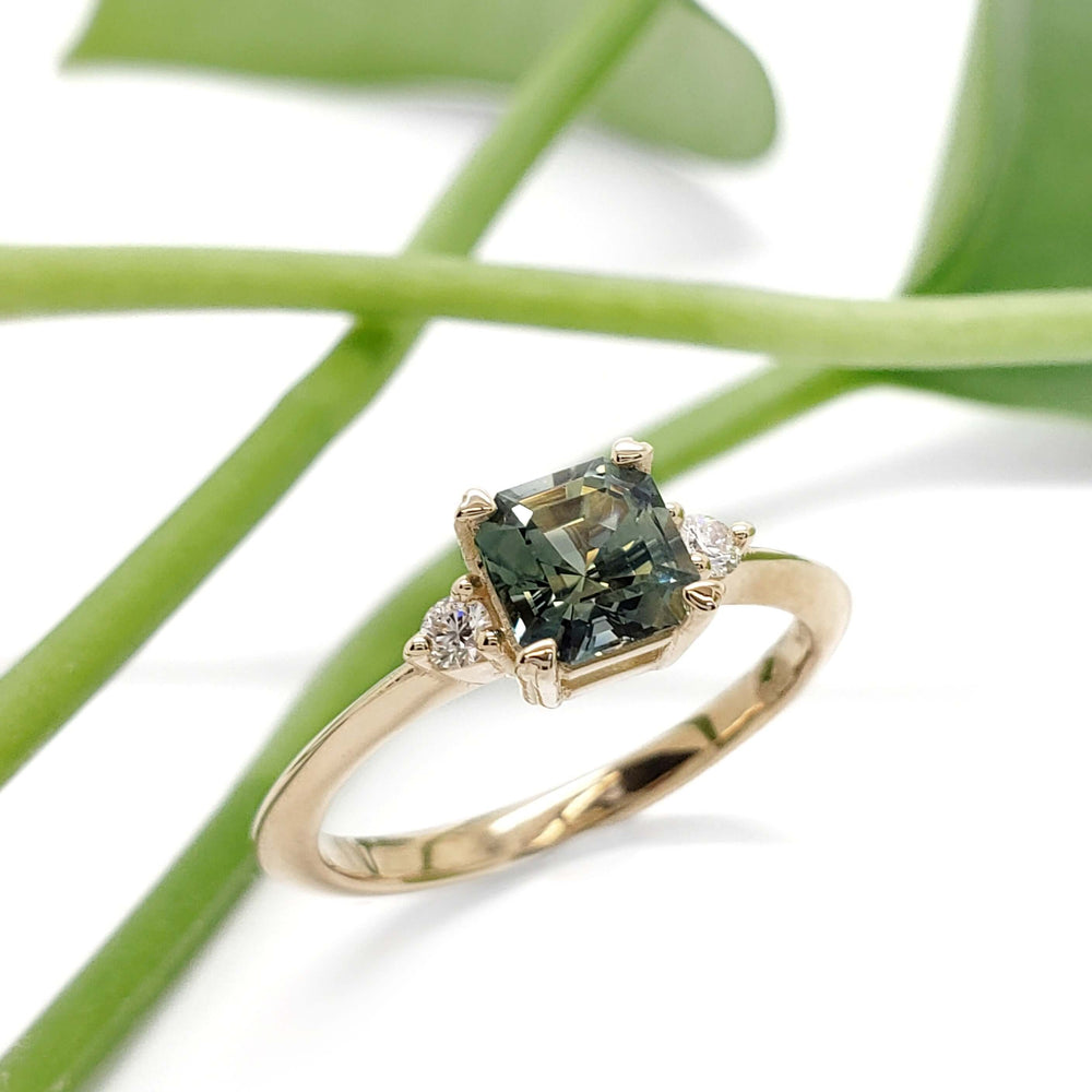 Parti sapphire and lab diamond engagement ring in yellow gold with leaf background