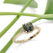 Parti sapphire and lab diamond engagement ring in yellow gold with leaf background