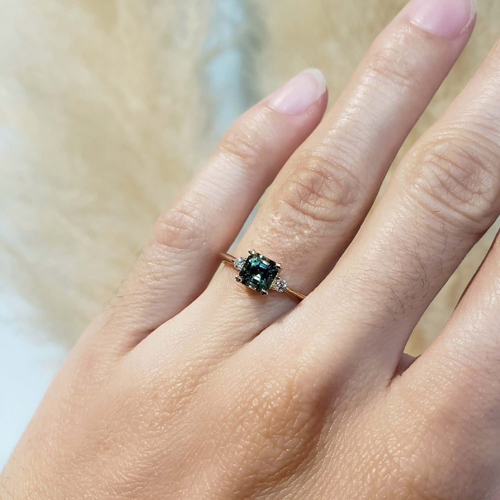 Parti sapphire and lab diamond yellow gold ring shown on hand