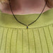 Pear blue sapphire pendant necklace in yellow gold, worn on model