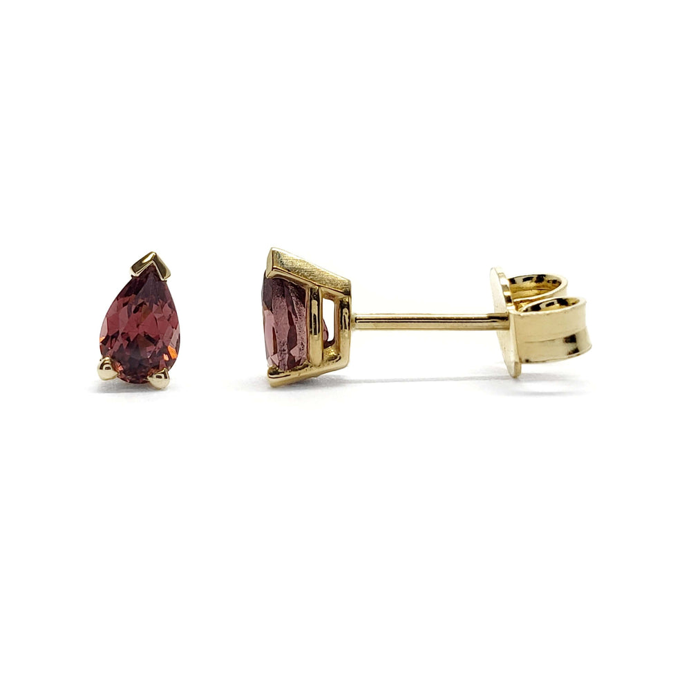 Pair of pear cut pink tourmaline stud earrings in 14kt yellow gold, side and front view