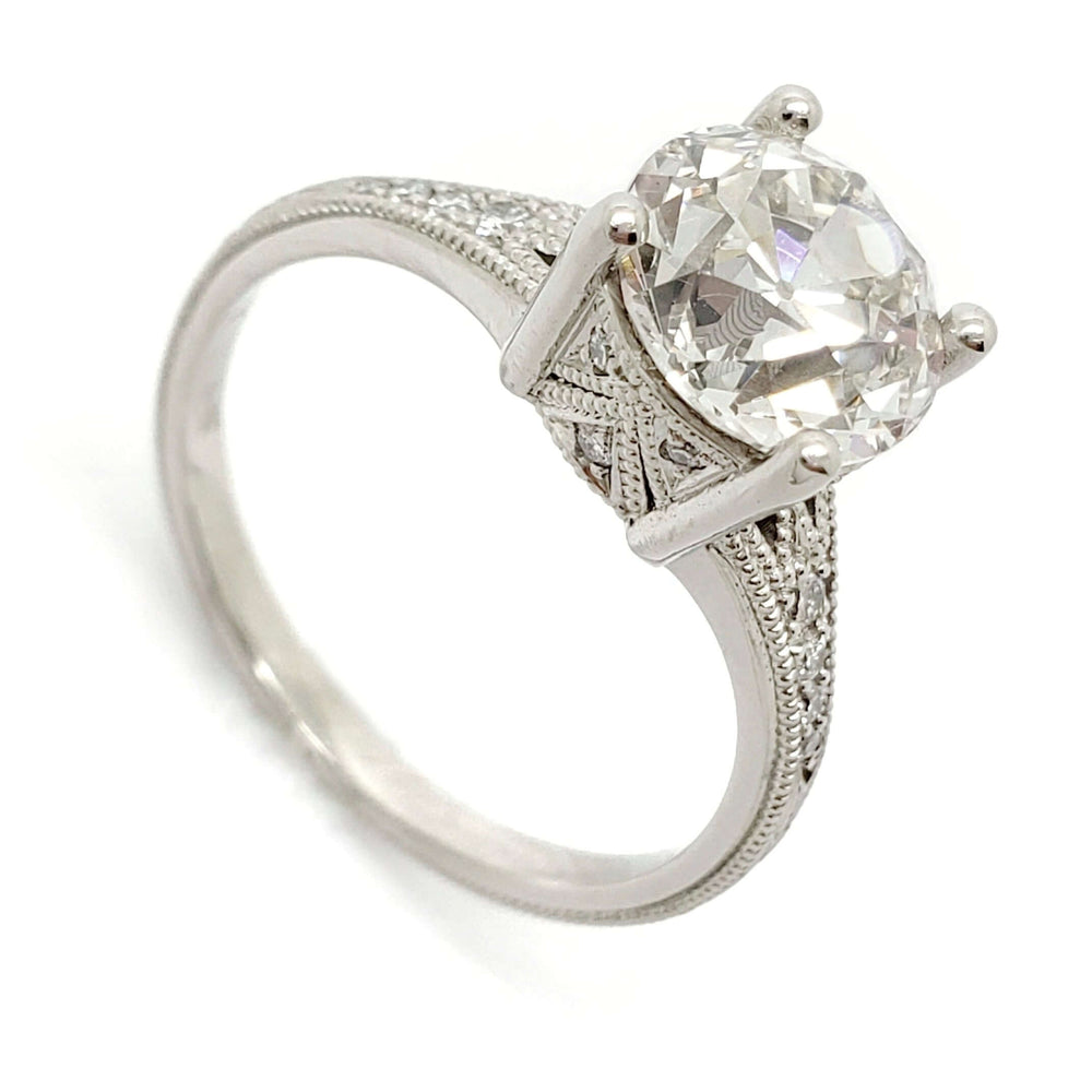 Platinum engagement ring with old European cut lab diamond and engraved millgrain details