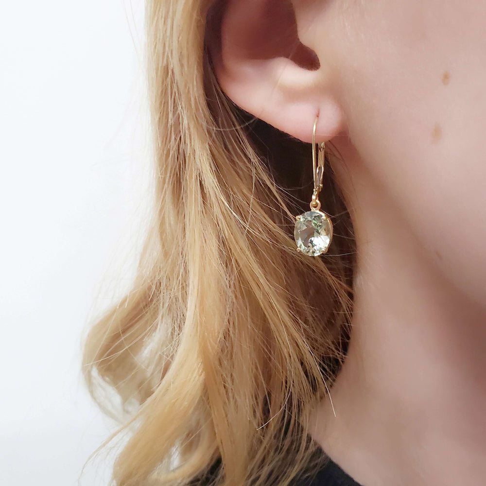 Prasiolite dangle earring in 14kt yellow gold worn on ear
