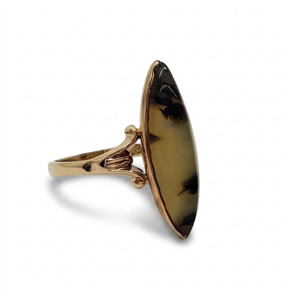 Profile view of vintage marquise agate ring with ornate 10kt yellow gold split-shank band