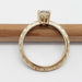 Profile of 14k yellow gold engagement ring with moissanite and wheat engraving