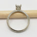 Profile of 14kt white gold engagement ring with milgrain and hand engraving, beside pencil