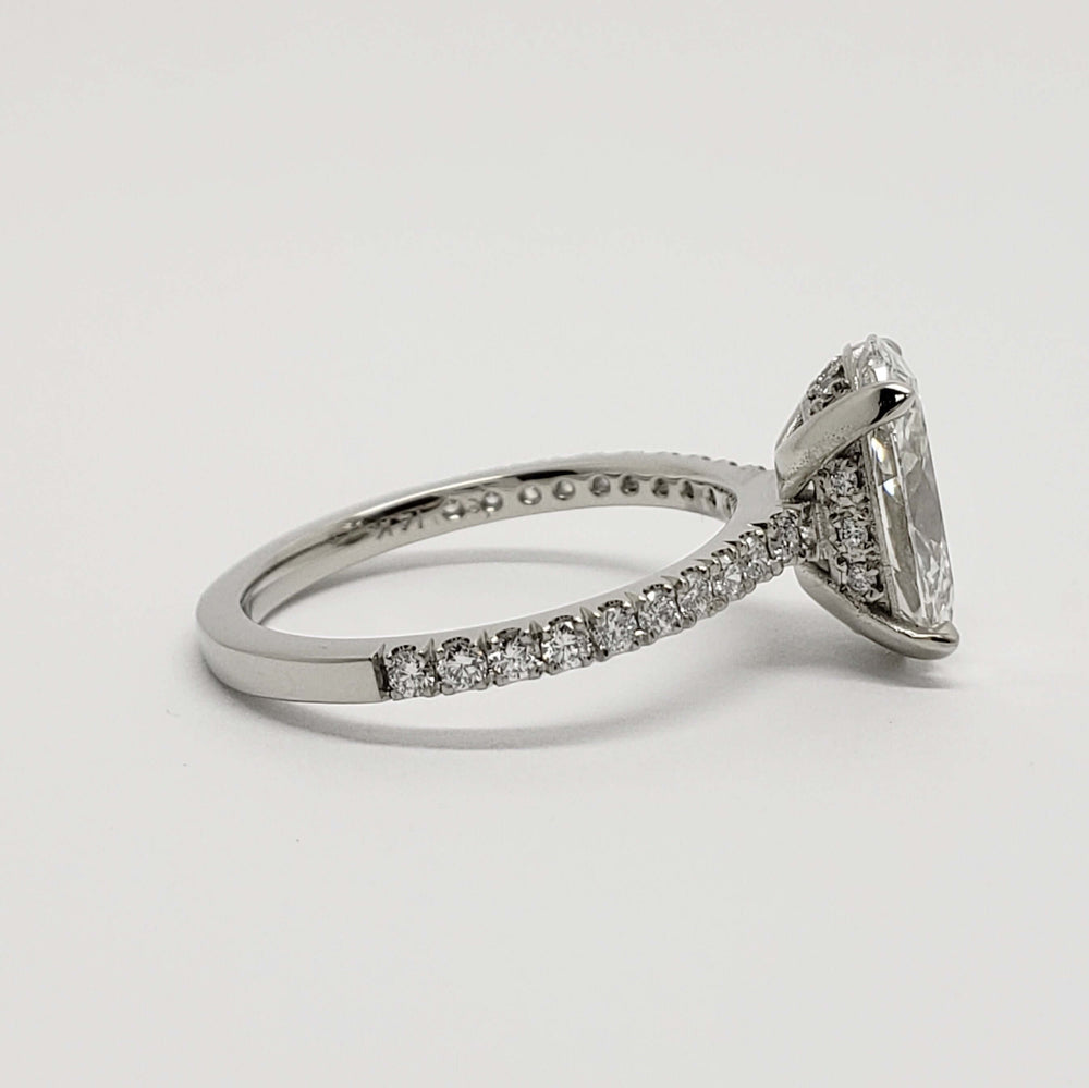 Profile of 14kt white gold engagement ring with oval lab diamond and pave-set band