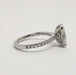 Profile of 14kt white gold engagement ring with oval lab diamond and pave-set band