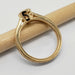 Profile of 14kt yellow gold engagement ring with millgrain and hand engraving, on pencil