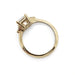 Profile view of yellow gold ring with asscher cut lab diamond and side diamonds