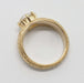 Profile of engraved yellow gold ring with millgrain edge and lab diamond setting