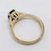 Profile of 14K yellow gold Montana sapphire ring showing millgrain band and gallery detail