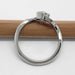 Profile view of white gold Montana sapphire ring with leaf motif