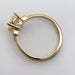Profile of yellow gold engagement ring with detailed millgrain and lab diamond setting