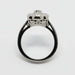 Profile view of Edwardian white gold engagement ring showing band engraving and diamond accents