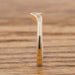 Profile view of 14k yellow gold chevron wedding ring with millgrain edge
