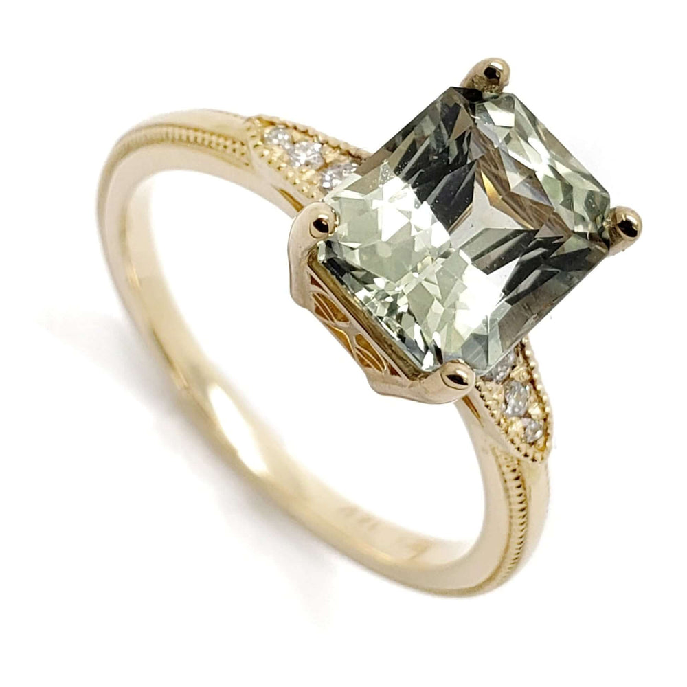 Radiant cut light green sapphire engagement ring in 14kt yellow gold with lab diamond accents